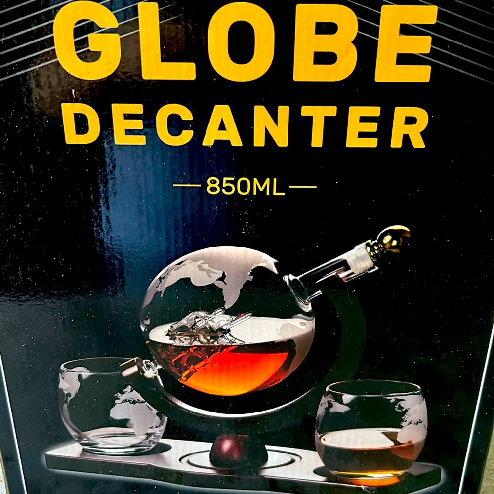 Globe decanter set with two glasses.